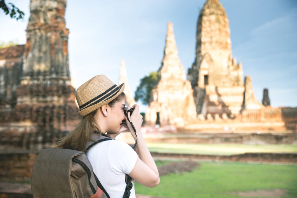 Young asian female traveler with backpack traveling Ayutthaya Pr