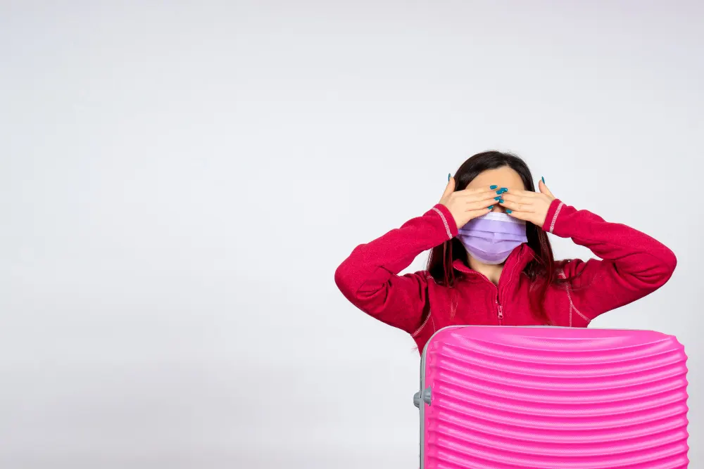 front-view-young-female-with-pink-bag-mask-white-wall-virus-woman-vacation-covid-pandemic-trip