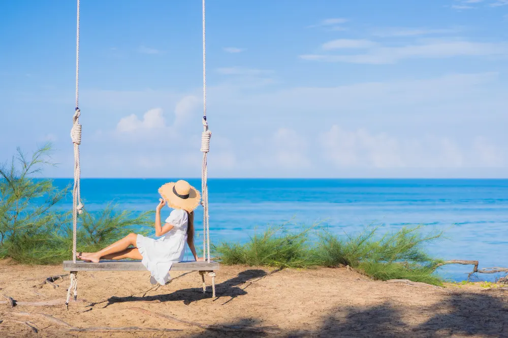 portrait-beautiful-young-asian-woman-relax-smile-swing-around-beach-sea-ocean-nature-travel-vacation