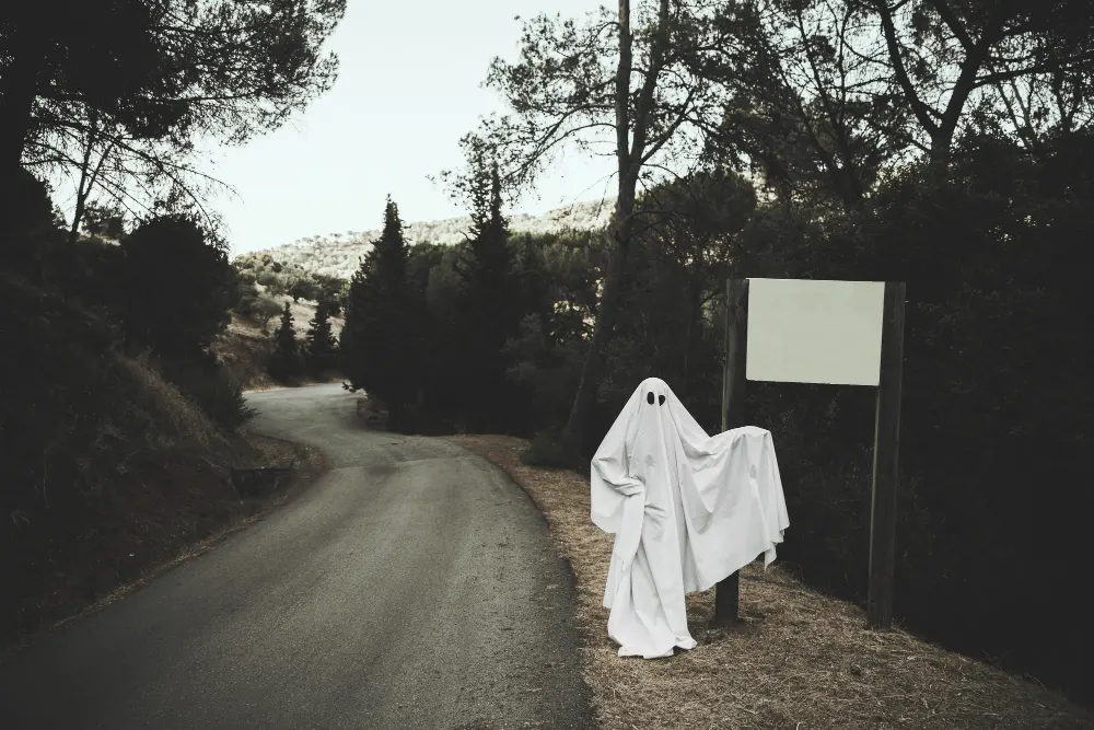 gloomy-ghost-standing-near-sign-board-in-forest