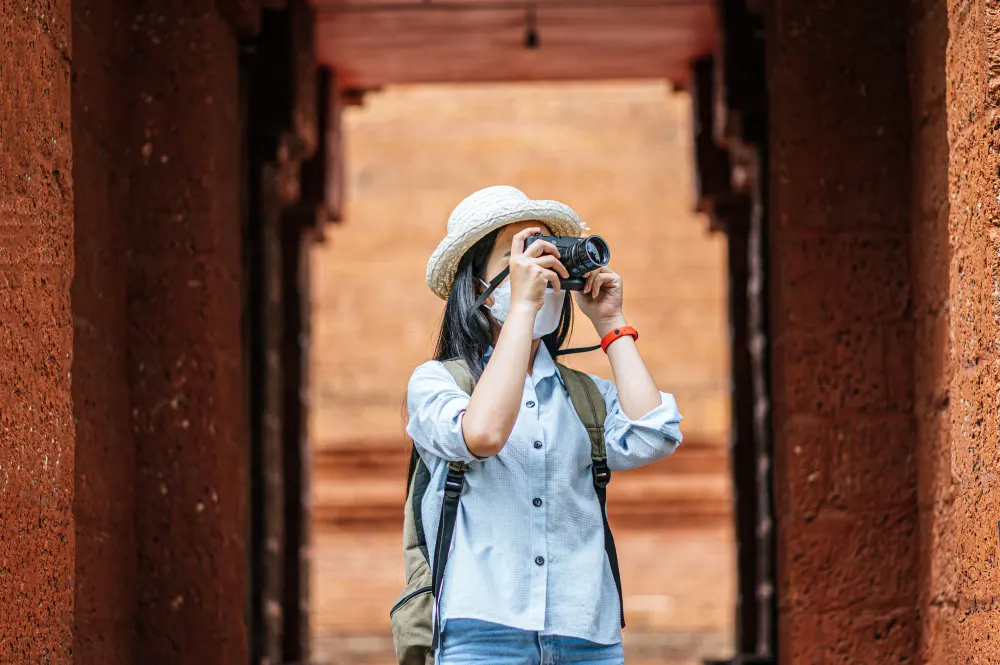 young-asian-backpacker-female-wearing-hat-and-protection