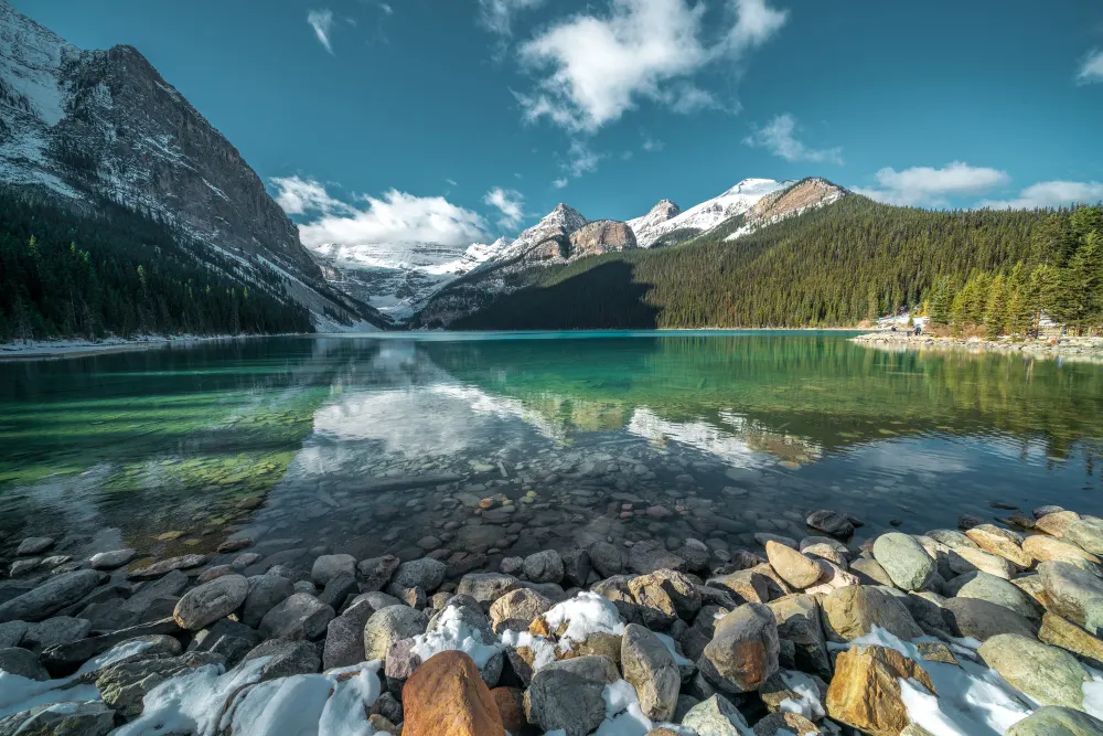 breathtaking-shot-beautiful-stones-turquoise-water-lake-hills-background