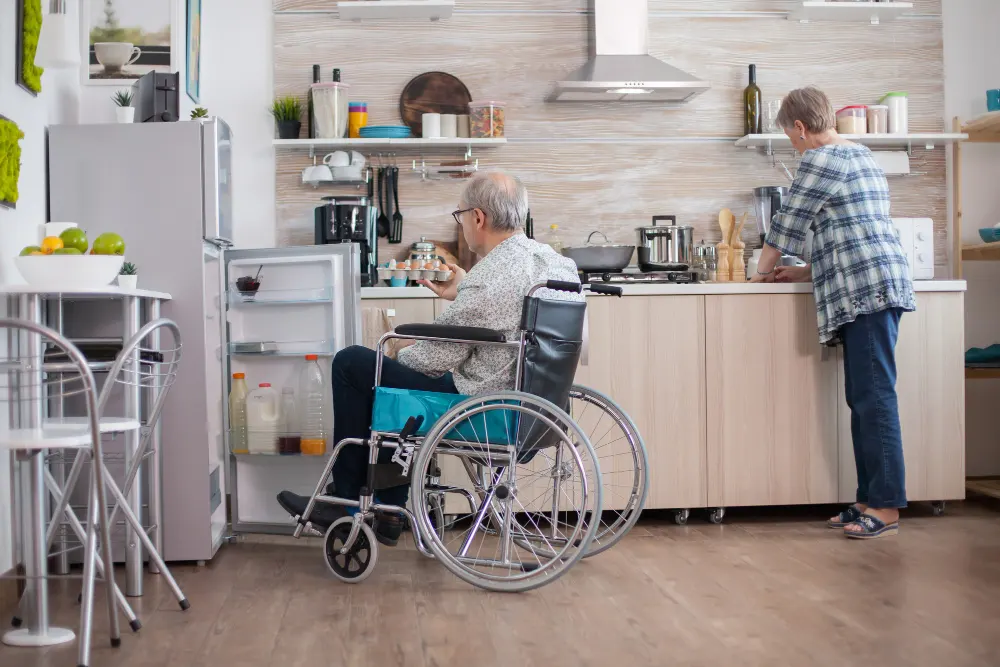 disabled-senior-man-wheelchair-taking-eggs-carton-from-refrigerator-wife-kitchen-senior