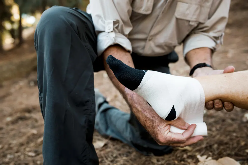 elderly-man-bandaging-his-wife