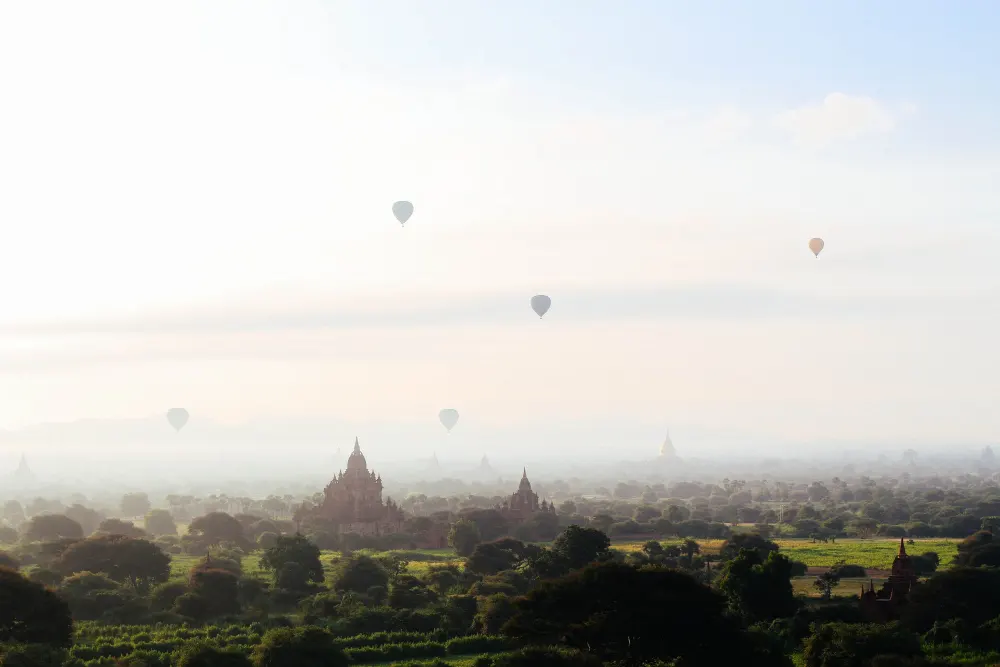 fantasy-concept-hot-air-balloons-flying-temples-castles-beautiful-field-sky
