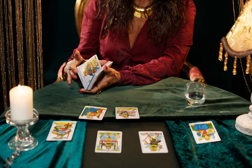 front-view-fortune-teller-with-tarot-cards