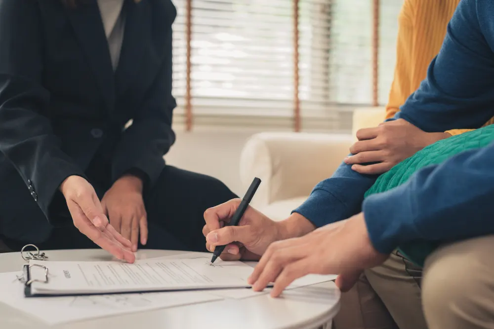 happy-young-asian-couple-realtor-agent