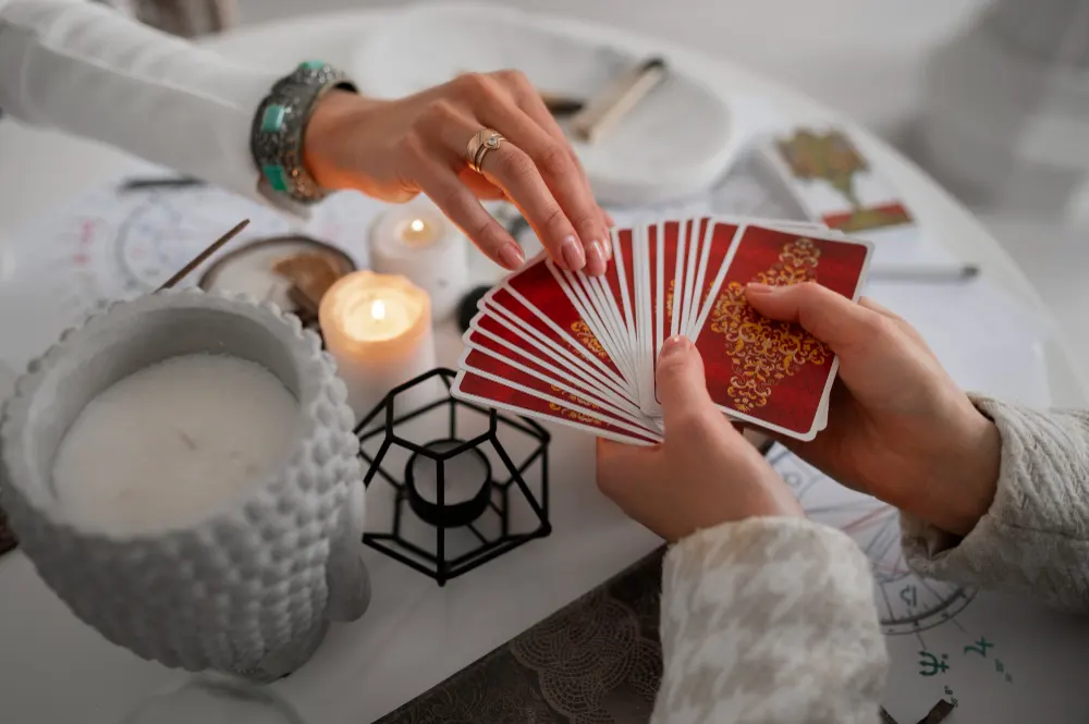 high-angle-woman-reading-tarot-home