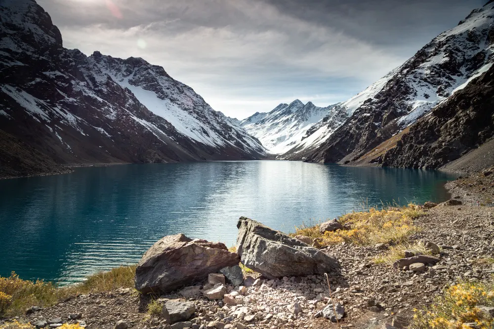 laguna-del-inca-lake-surrounded-by-high-mountains-covered-snow-chile