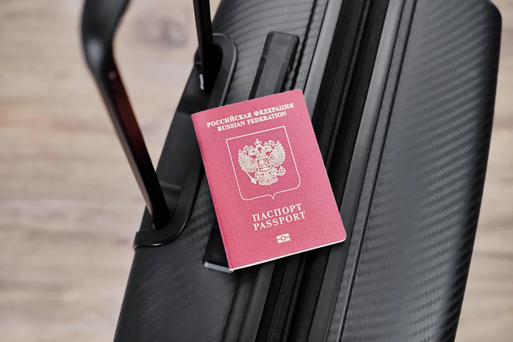 russian-passport-black-travel-suitcase-top-view-selective-background-emigration-russians-seeking-asylum