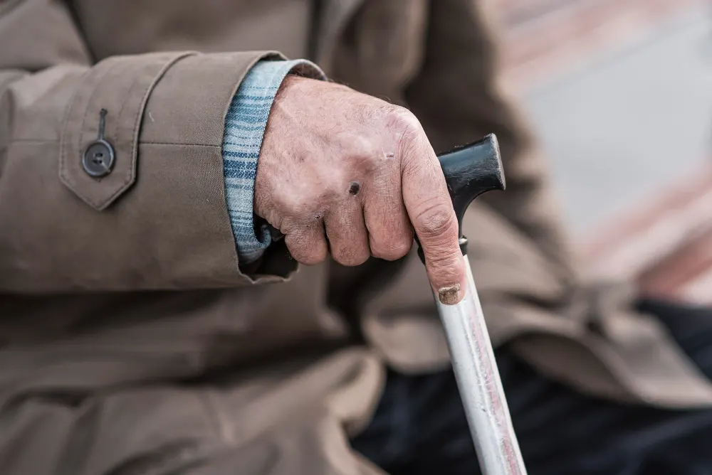 side-view-homeless-man-with-cane