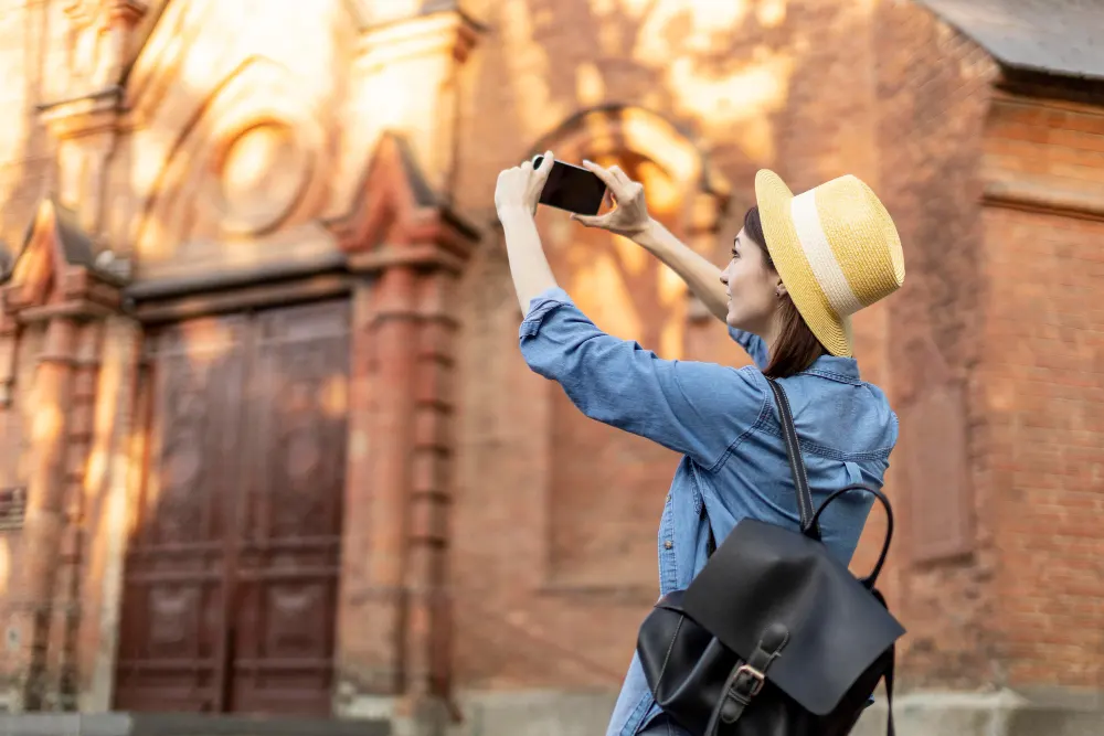 stylish-tourist-with-hat-taking-pictures-vacation