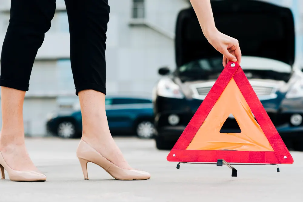 woman-placing-emergency-sign