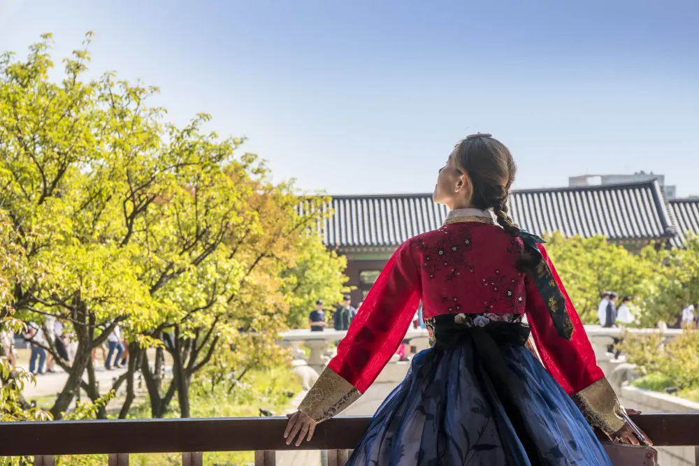woman-traditional-korean-clothing-looking-up-sky
