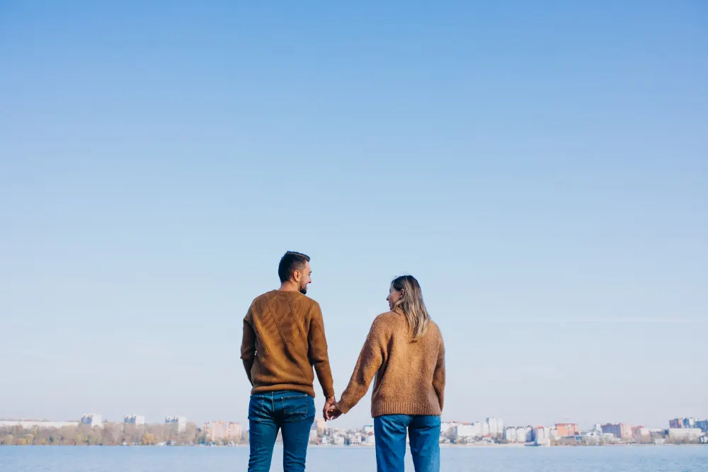 young-couple-park-standing-by-river