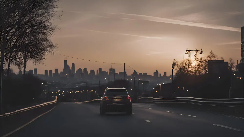 car-driving-on-a-highway-in-the-city-at-sunset-side-view