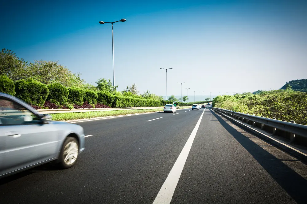 car-on-asphalt-road-in-summer