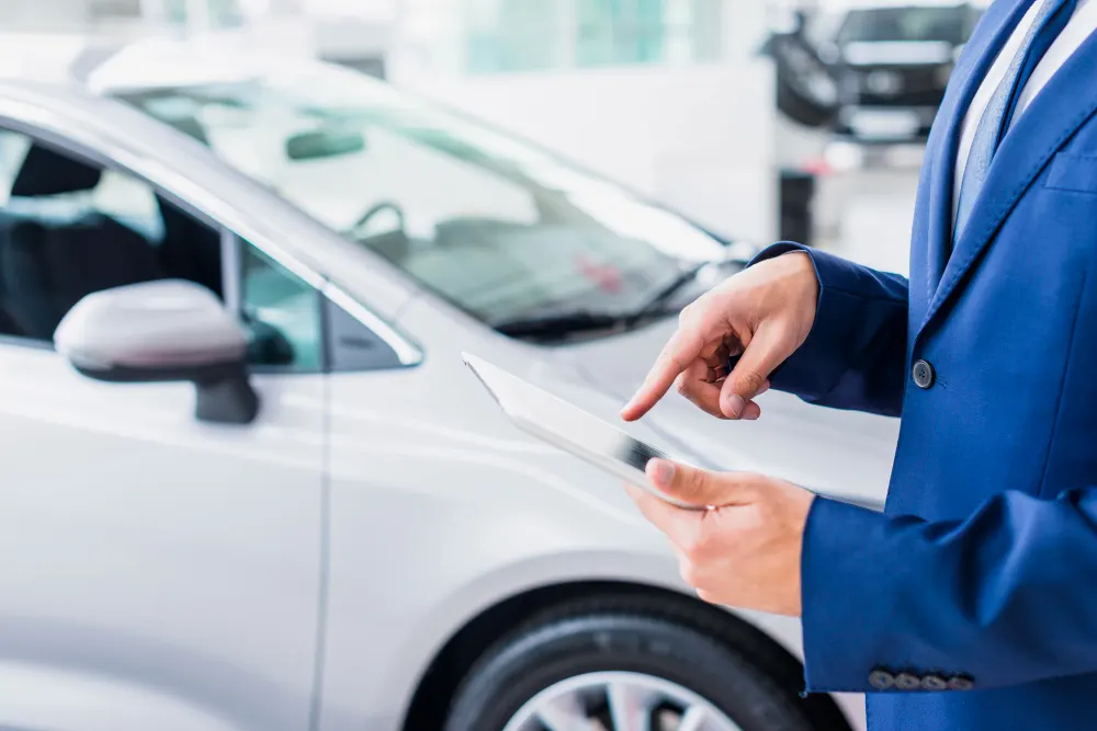 car-salesman-with-tablet