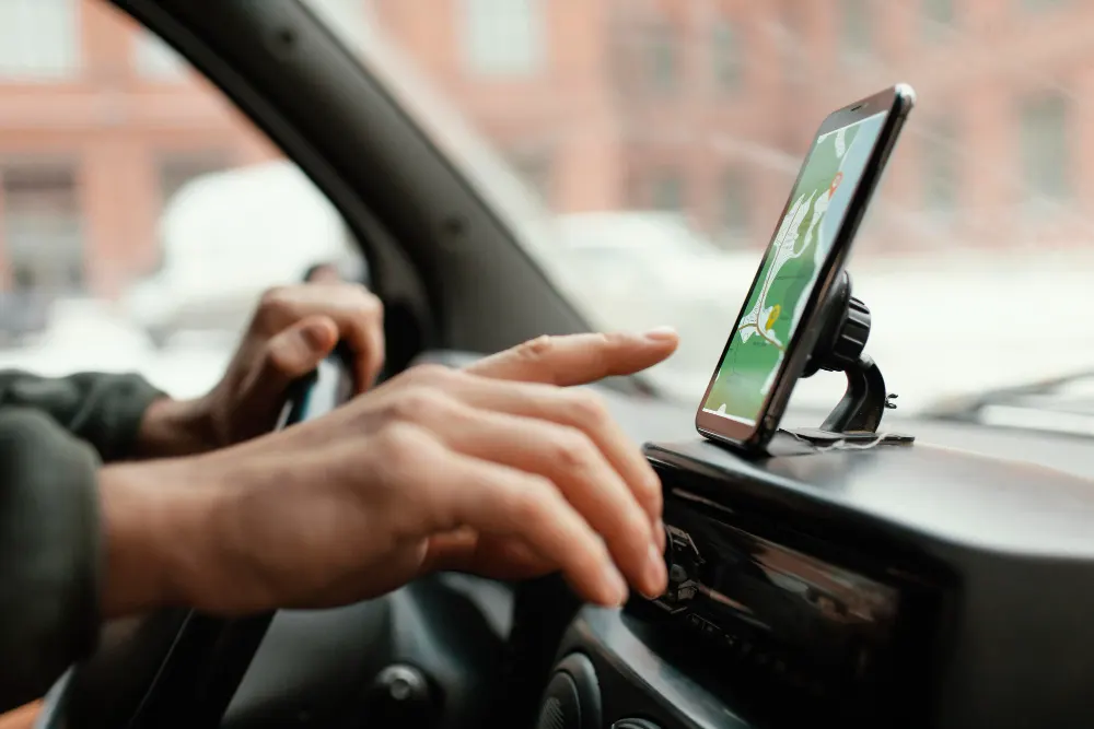 close-up-man-in-the-car-with-map-on-mobile