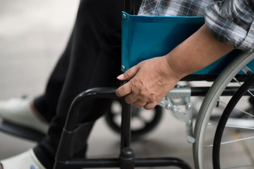 close-up-of-senior-woman-hand-on-wheel