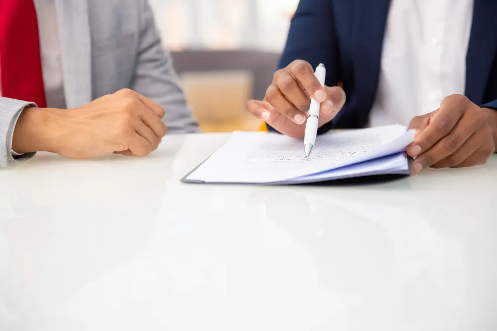 cropped-shot-of-business-people-reading- contract