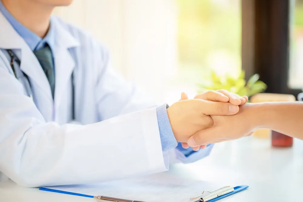 doctor-holding-male-patients-hand