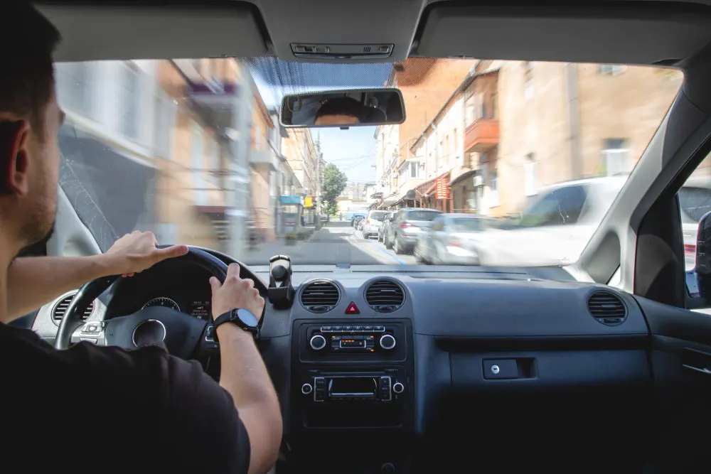 hands-on-the-wheel-when-driving-at-high-speed-from-inside-the-car