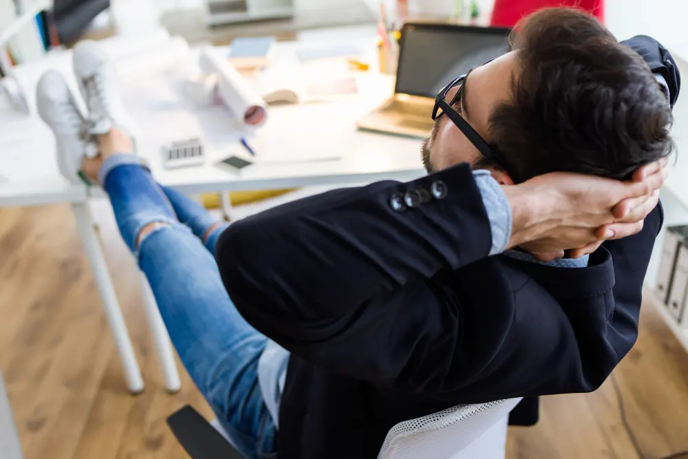 handsome-young-businessman-relaxing-one-moment-in-the-office