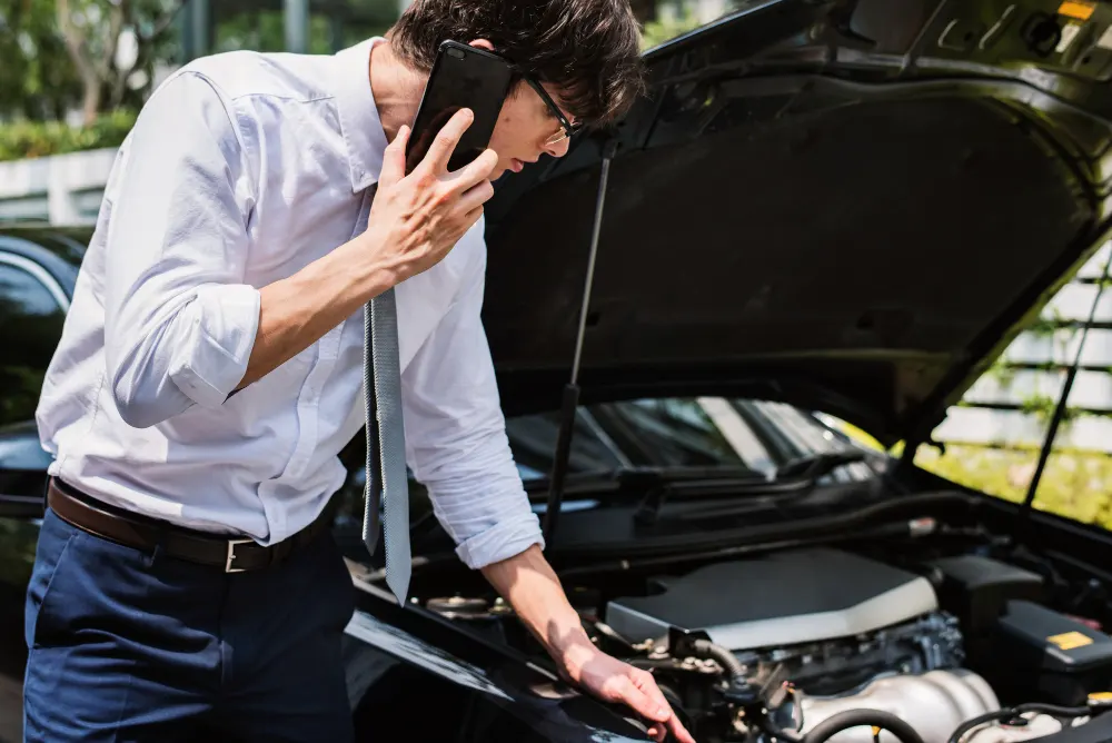 man-calling-for-help-to-fix-his-car