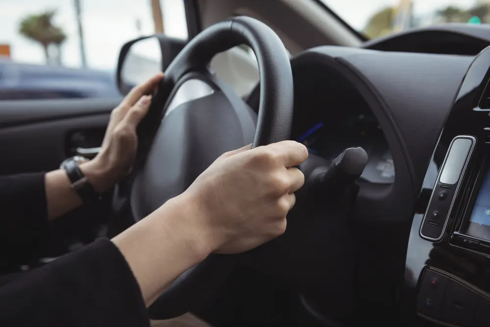 man-driving-electric-car