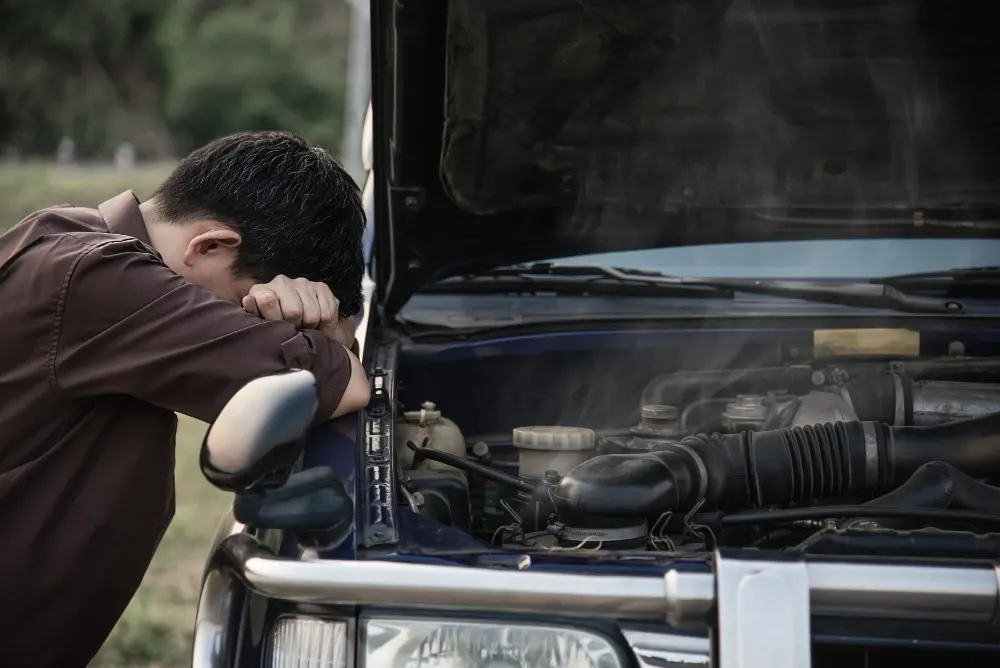 man-try-to-fix-a-car-engine-problem