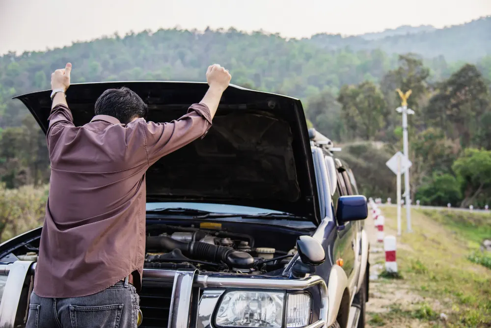 man-try-to-fix-a-car-engine-problem