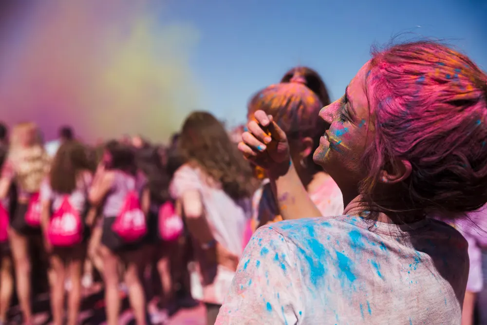 rear-view-of-a-young-woman-playing-with-holi-powder