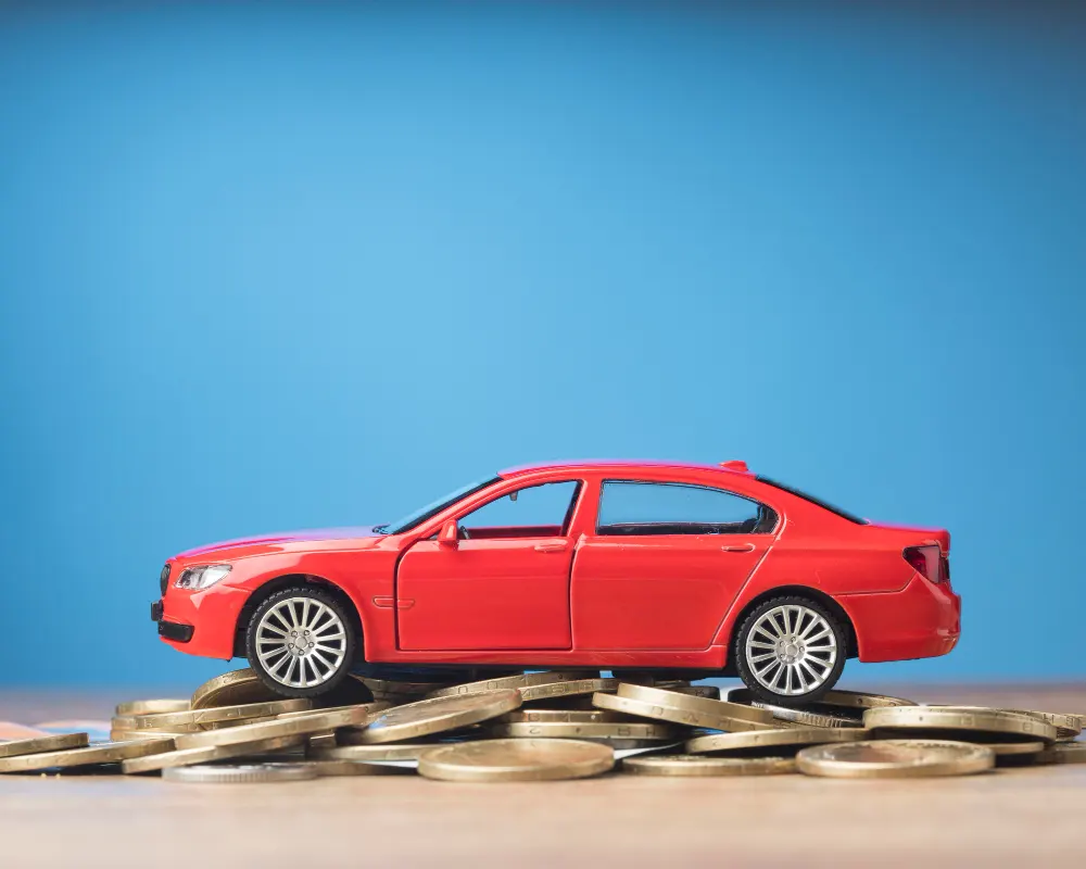 red-car-on-a-bunch-of-coins