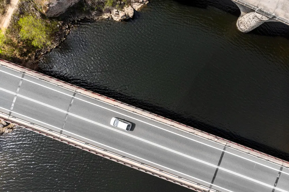 transport-concept-with-car-on-bridge- top-view