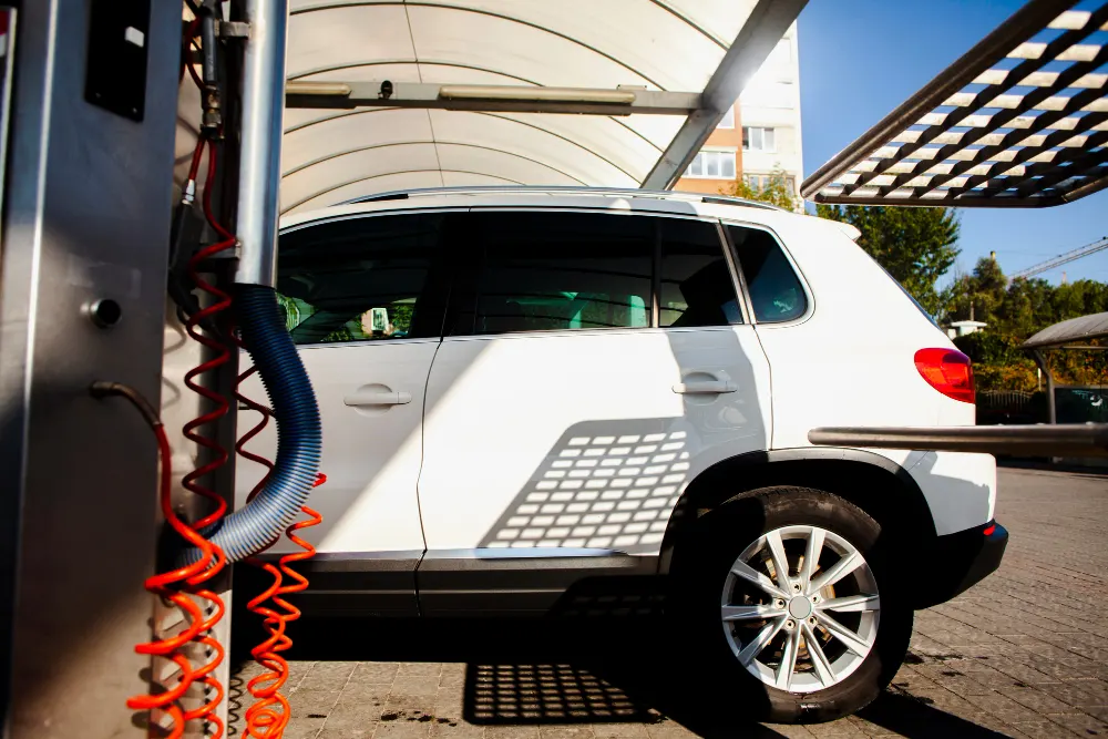 white-car-entering-in-a-car-wash