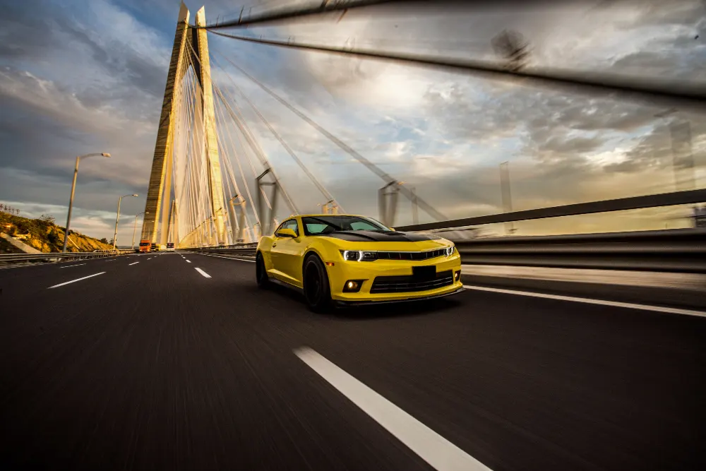 yellow-sport-car-with-black-autotuning-on-the-bridge