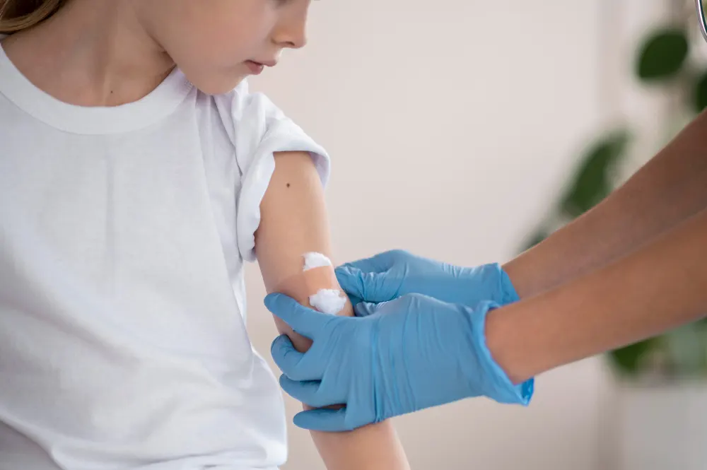 young-doctor-making-sure-a-little-girl-is-fine-after-vaccination