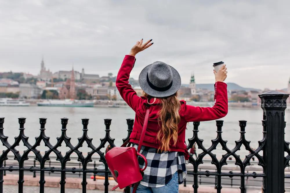 young-woman-waving-hands-in-city