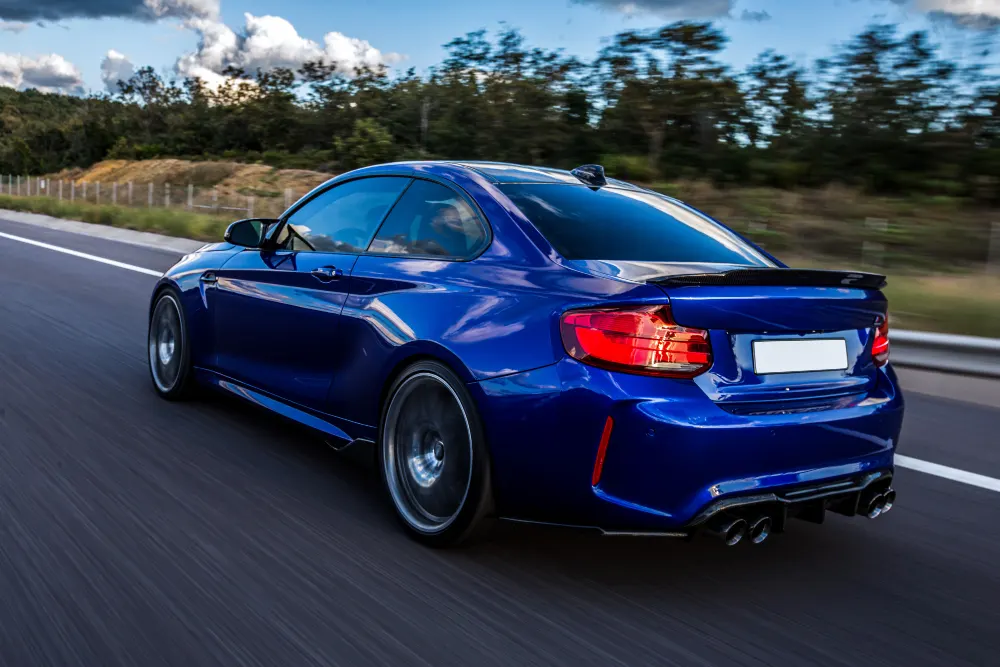 blue-car-driving-road