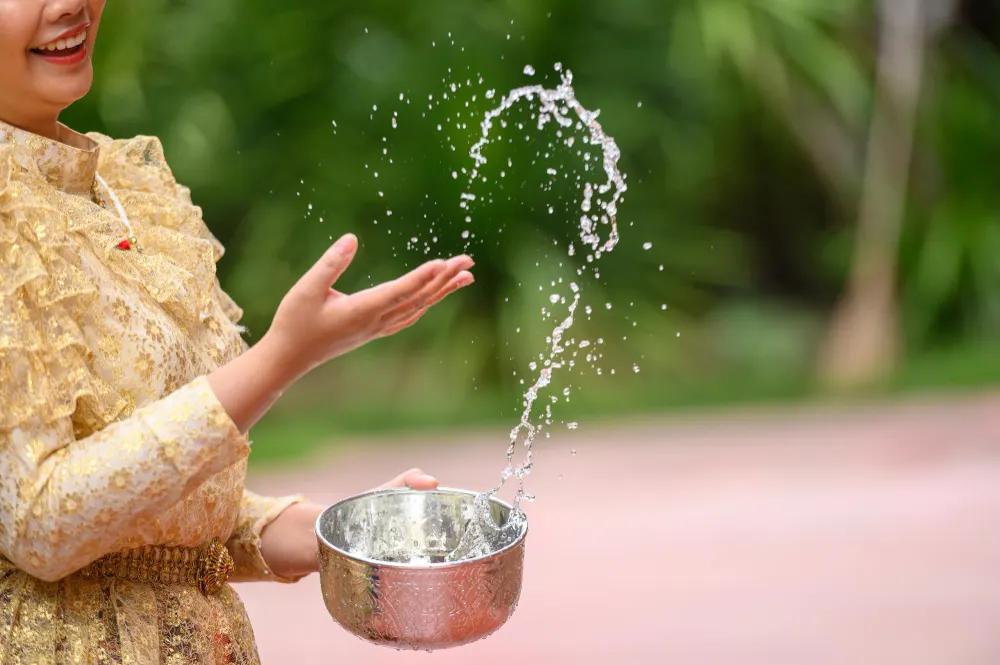 female-hand-holding-water-bowl