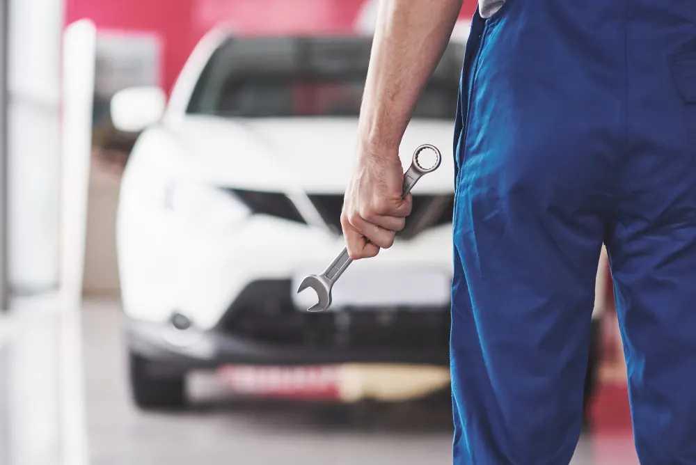 hand-car-mechanic-with-wrench