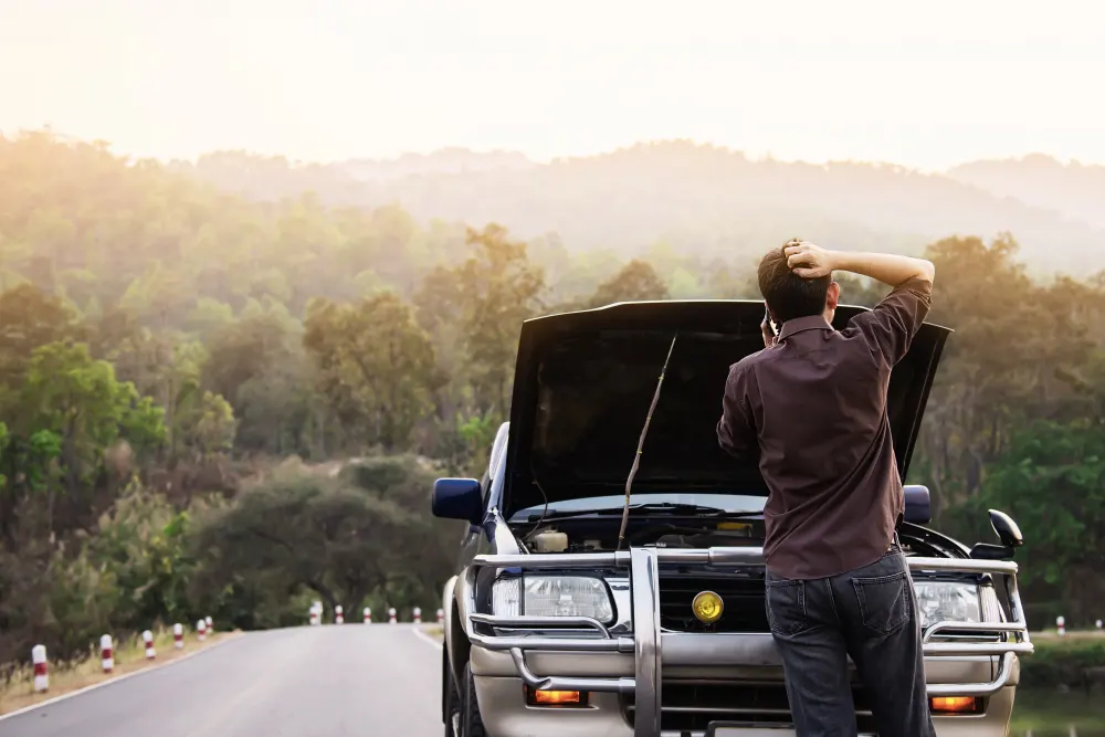 man-trying-to-fix-car