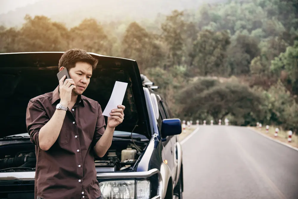 man-trying-to-fix-car