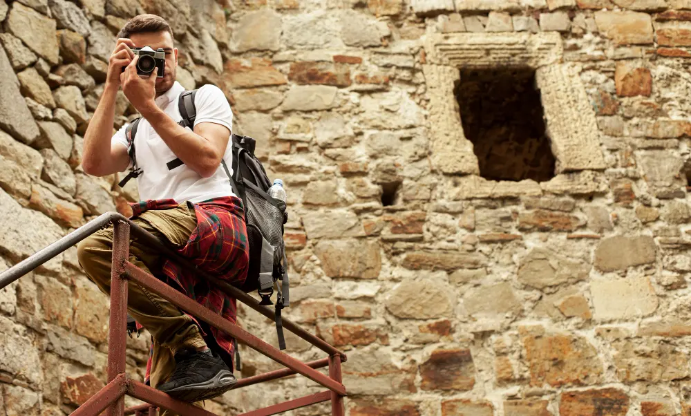 man-with-camera-castle-stairs-taking-photos