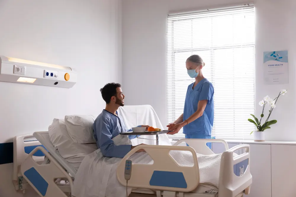 patient-in-bed-talking-to-nurse