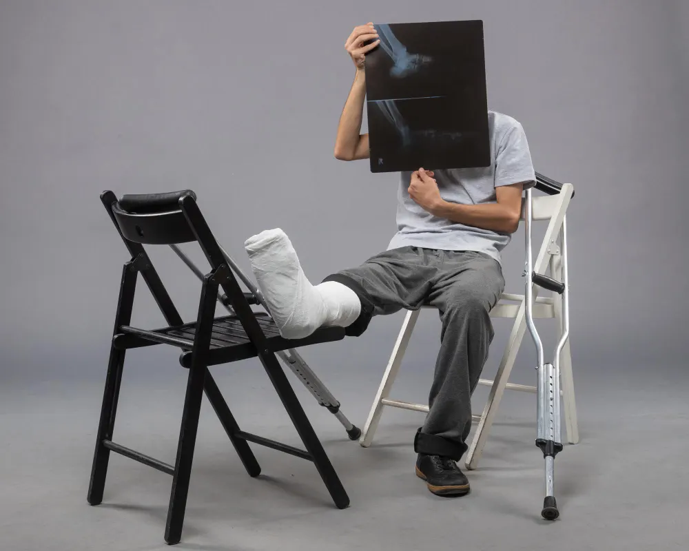 young-male-sitting-with-broken-foot