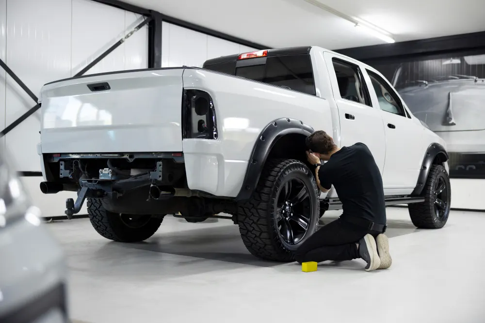 full-shot-professional-man-working-on-car