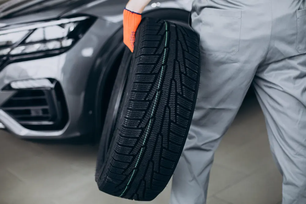 mechanic-changing-tire-in-a-car-service