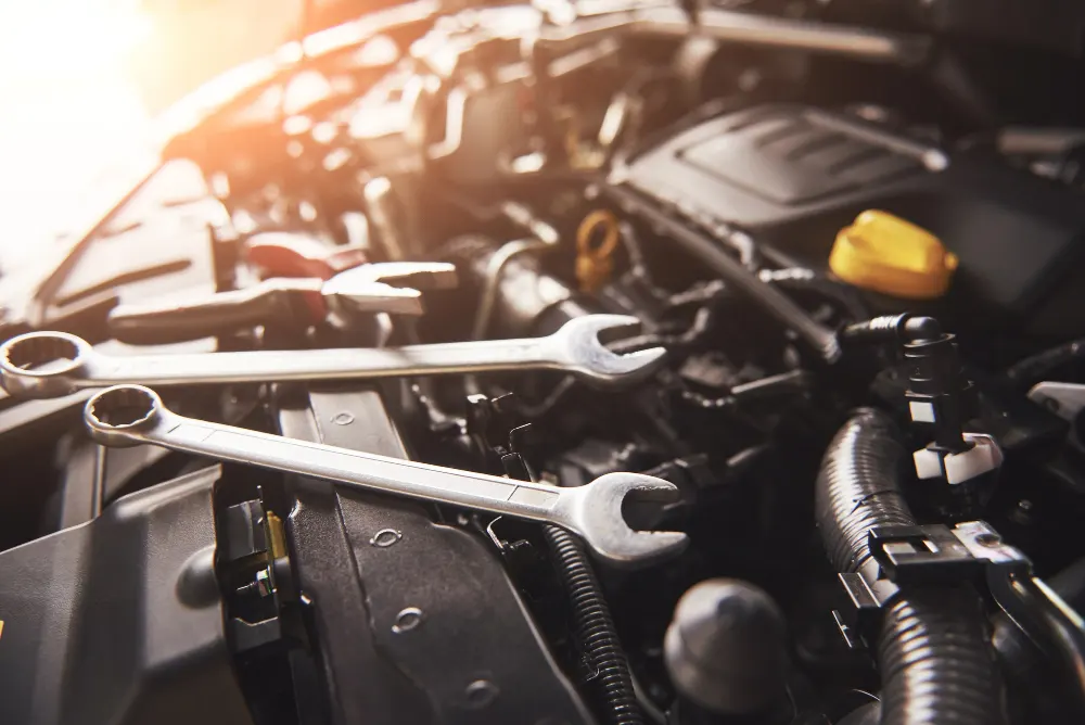 mechanic-hand-checking-and-fixing-a- broken-car-in-car